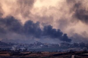 Smoke rises above destroyed buildings in the northern Gaza Strip during an Israeli army bombardment