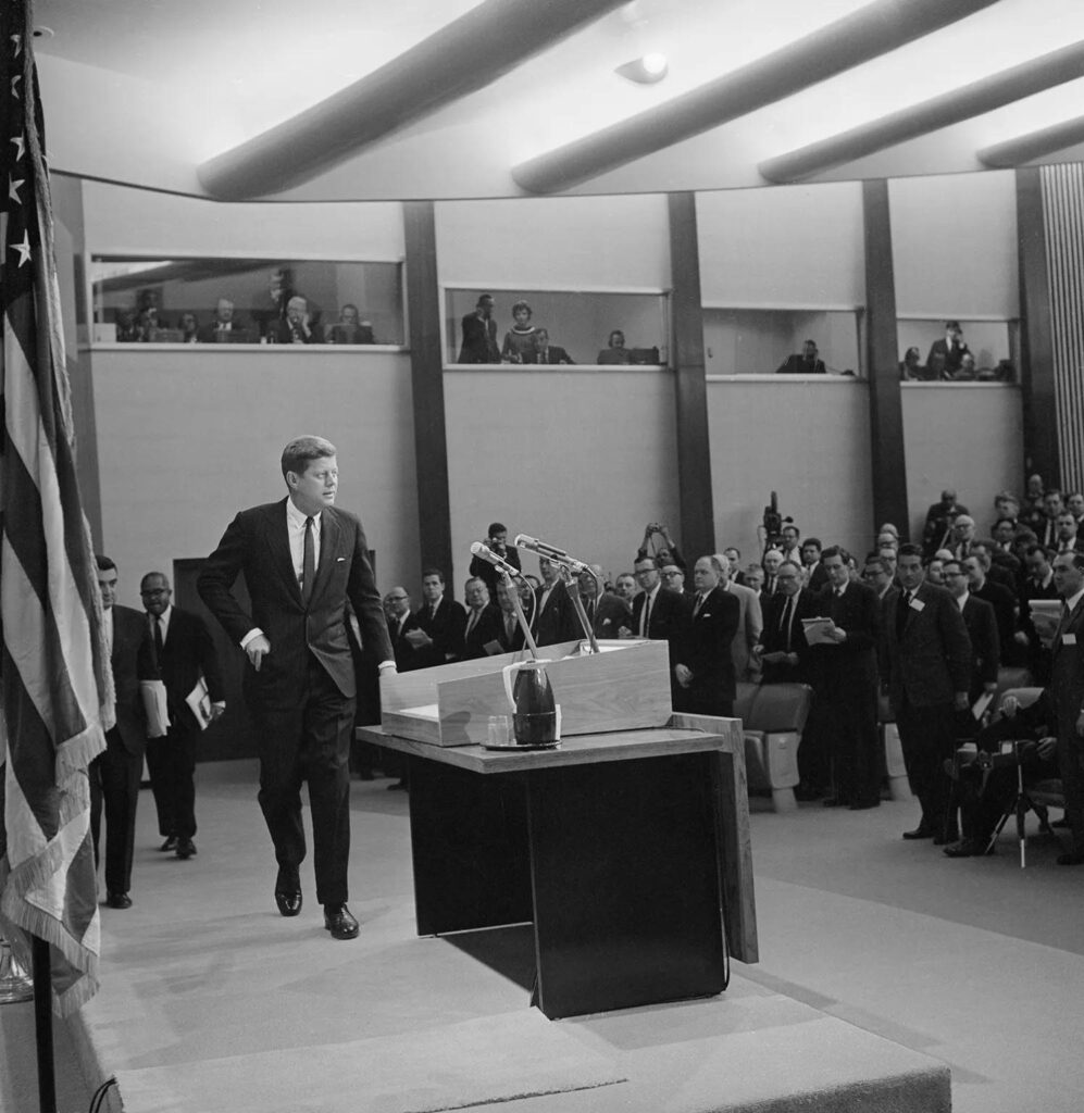 U.S. President John F. Kennedy receives a standing ovation as he walks into the State Department’s new auditorium to hold his first news conference since taking office, on Jan. 25, 1961. Kennedy spoke about Geneva negotiations with Russia over a nuclear test ban treaty.